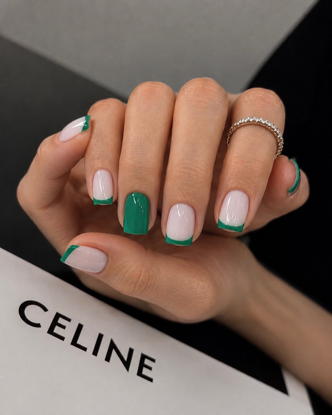 Emerald green manicure with white line accent
