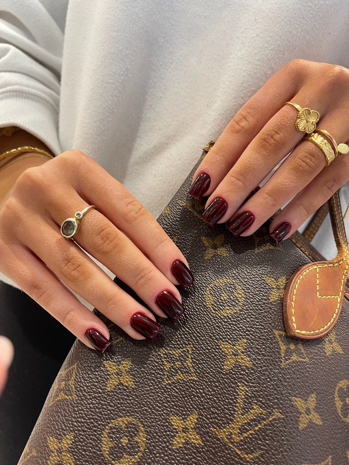 Deep burgundy glossy round manicure