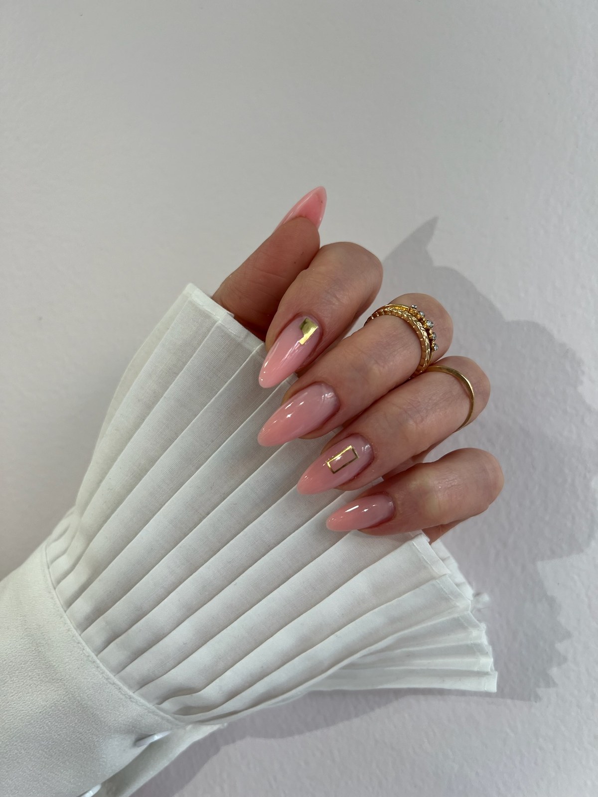 Glossy white almond manicure