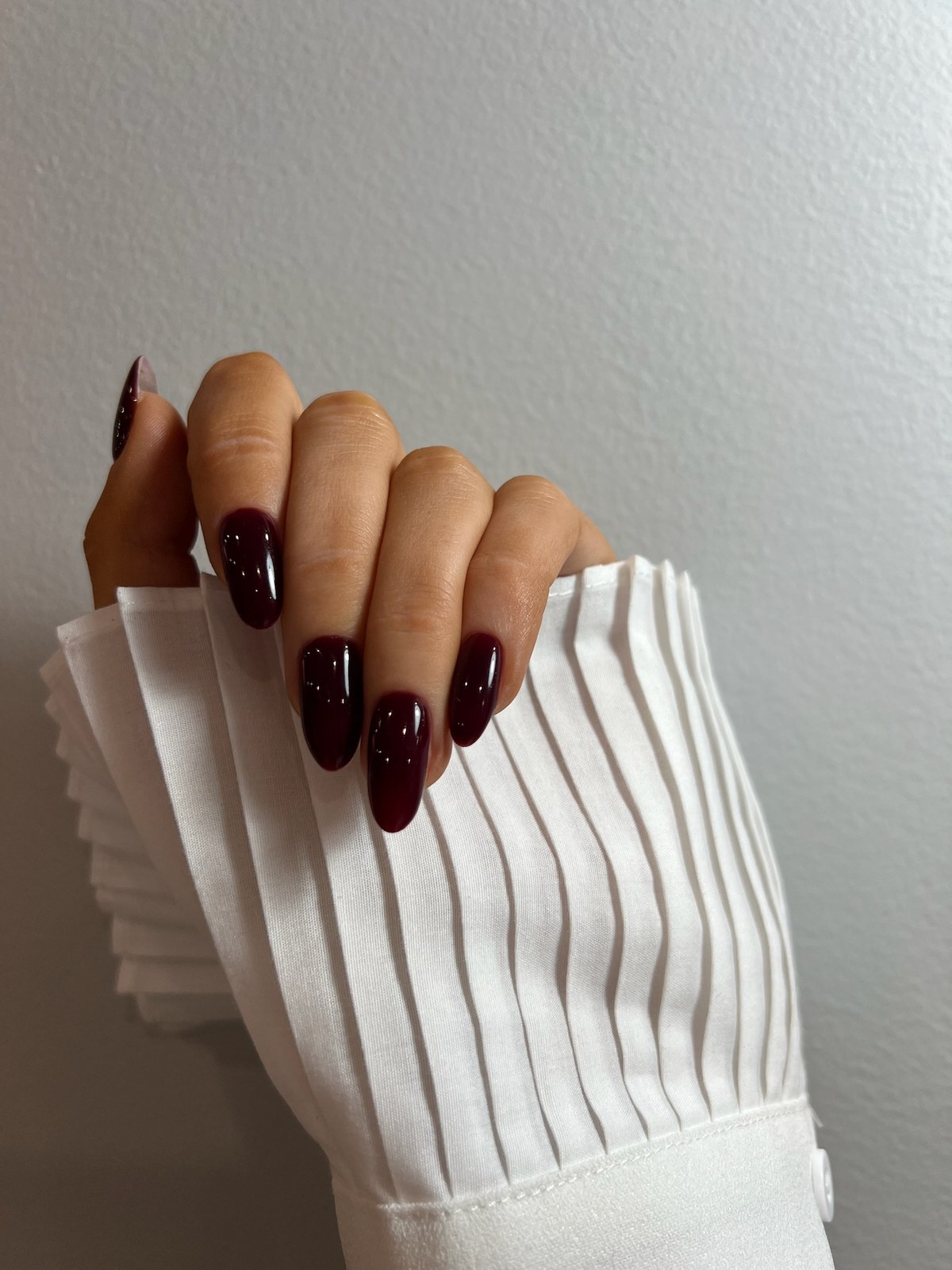 Deep burgundy glossy manicure