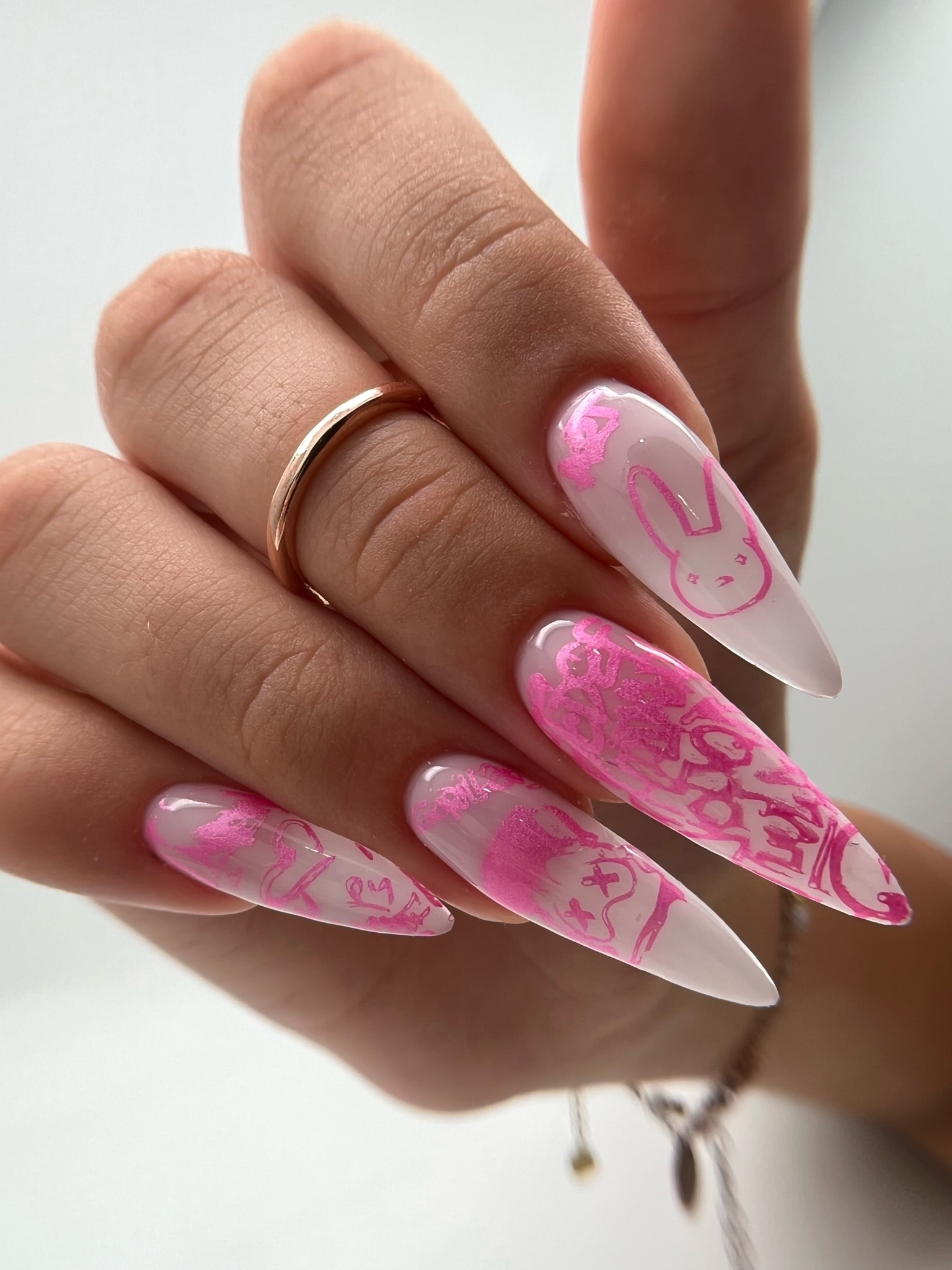 Bold graffiti-style nail art on stiletto extensions
