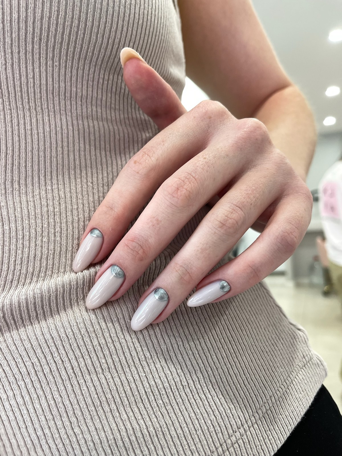 Gray marbled nail art on white base