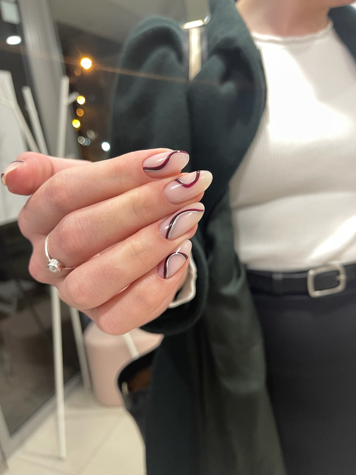 Nude manicure with delicate black line nail art