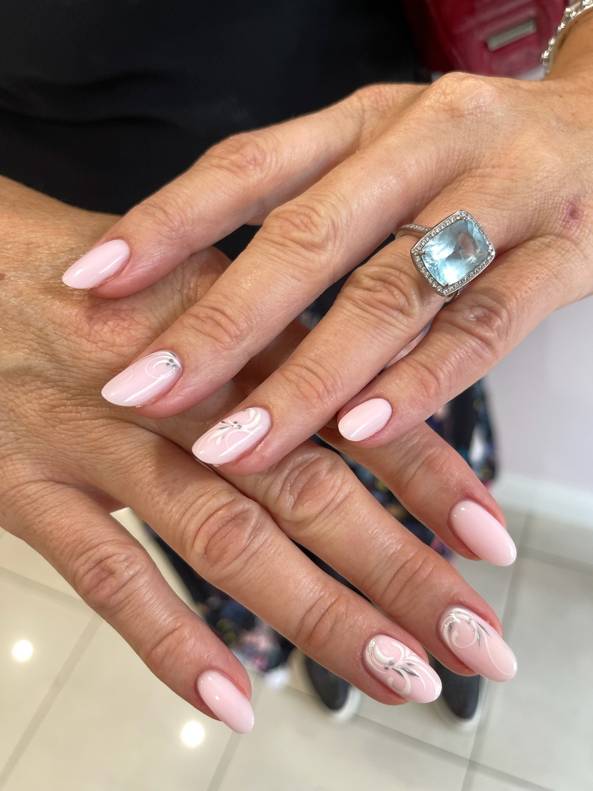 Pink manicure with delicate marbled nail art