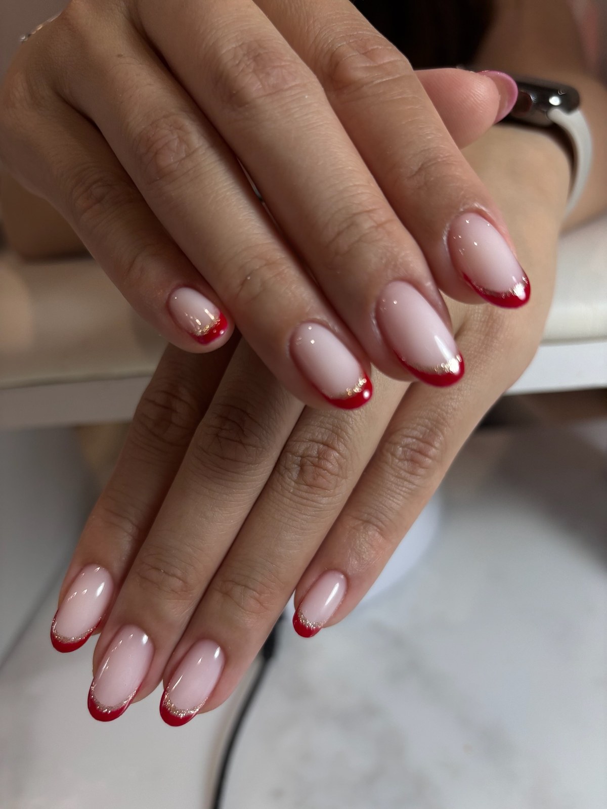 Nude manicure with red french tip color-block design