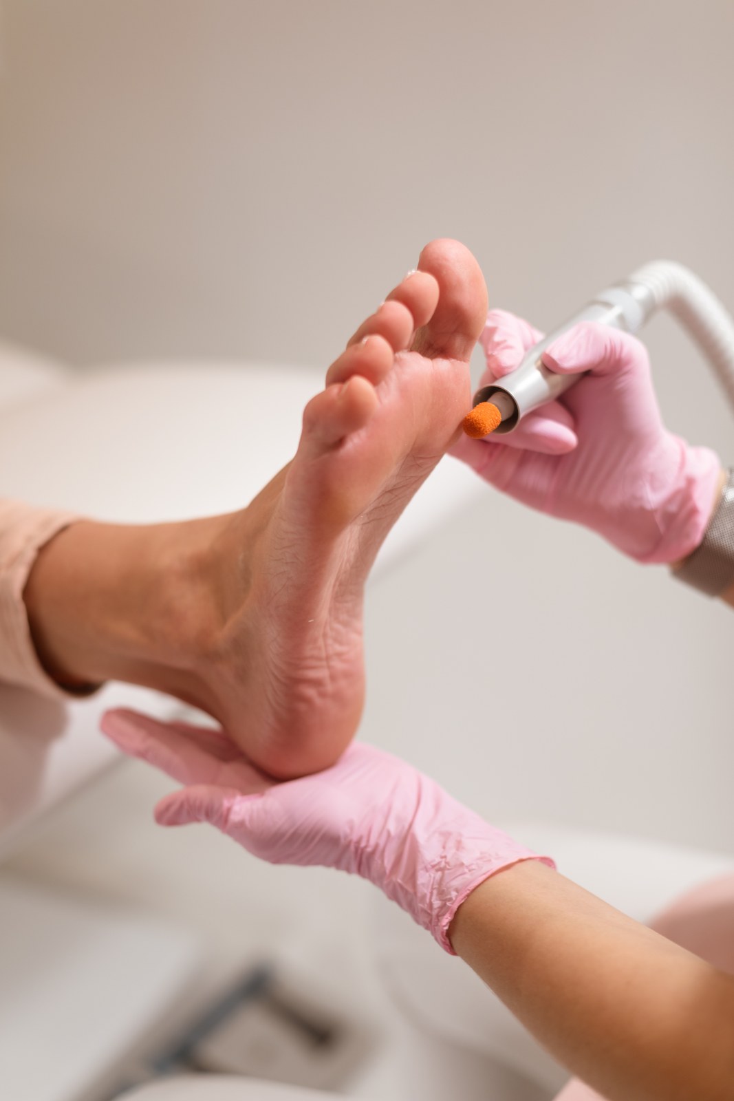 Close-up of pedicure nail filing treatment in progress